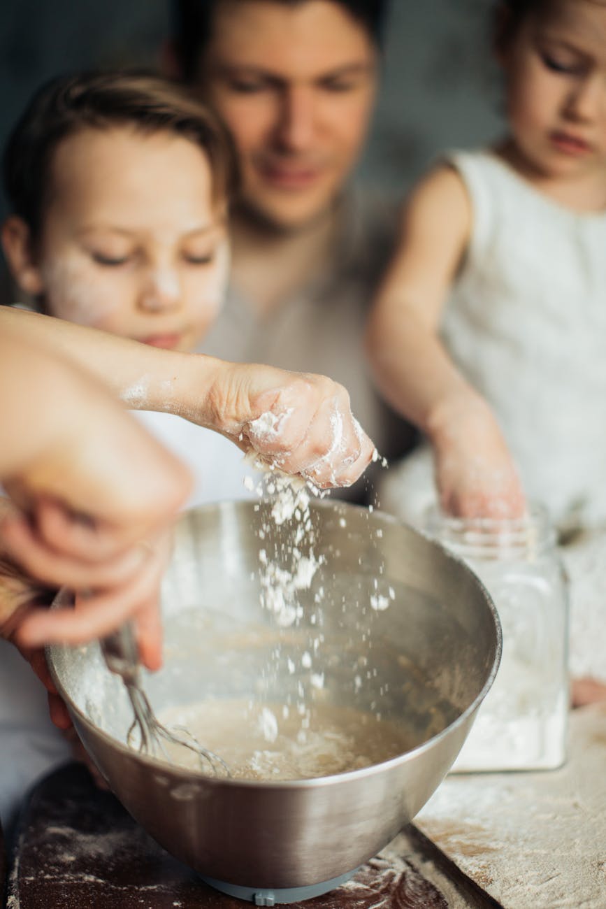 photo of hands grasping flour