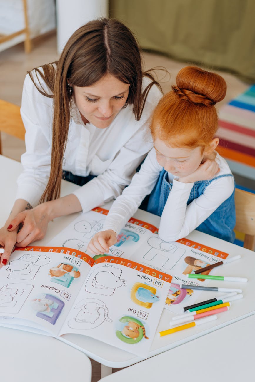 a girl learning alphabets